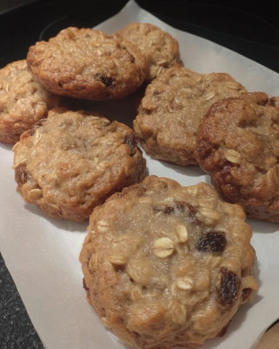 Oatmeal raisin cookies served with a glass of milk