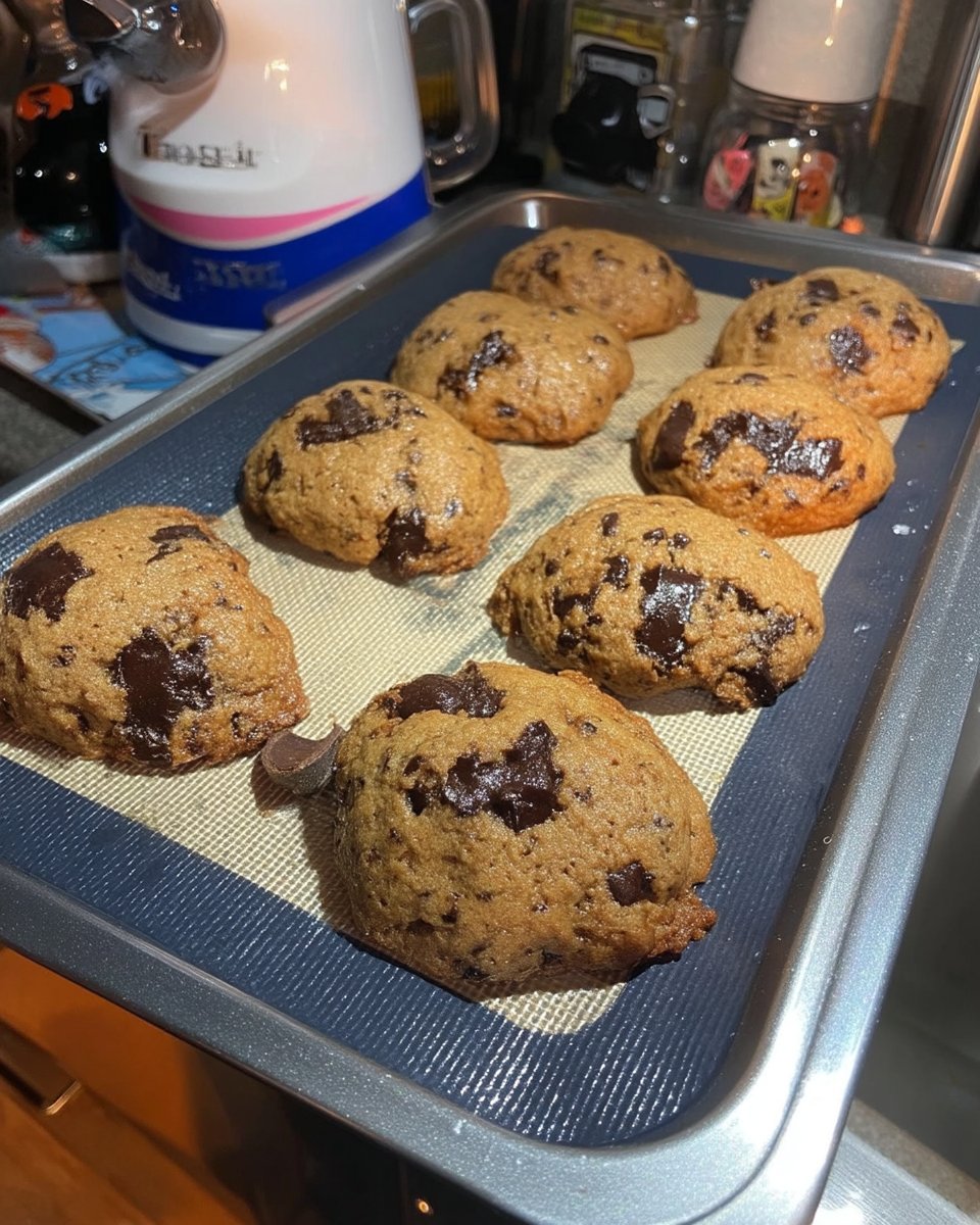 Broma Bakery Chocolate Chip Cookies 14 A stack of warm Broma Bakery chocolate chip cookies served with a cold glass of milk