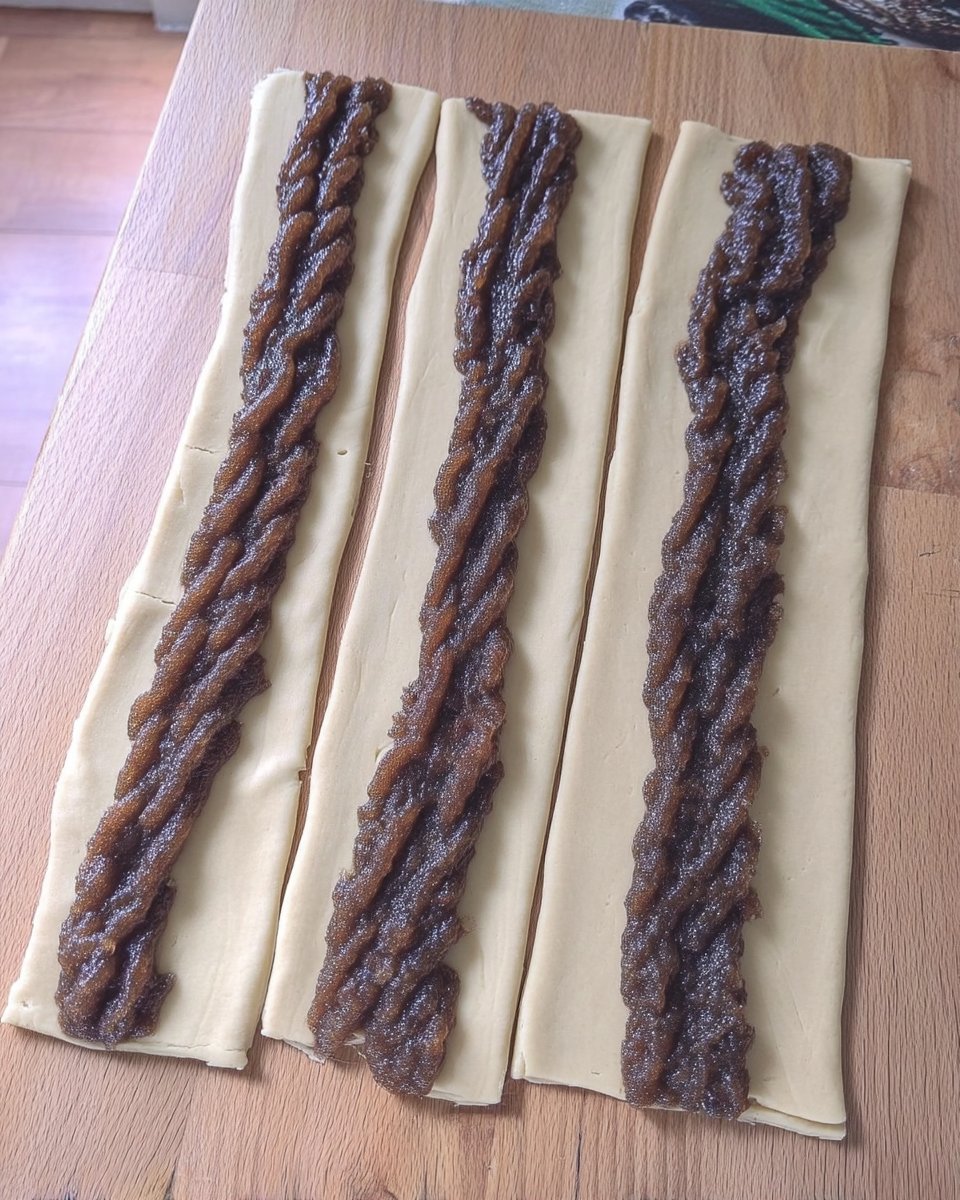 Strawberry Newtons 13 Slicing stuffed strawberry newton dough logs with a serrated knife