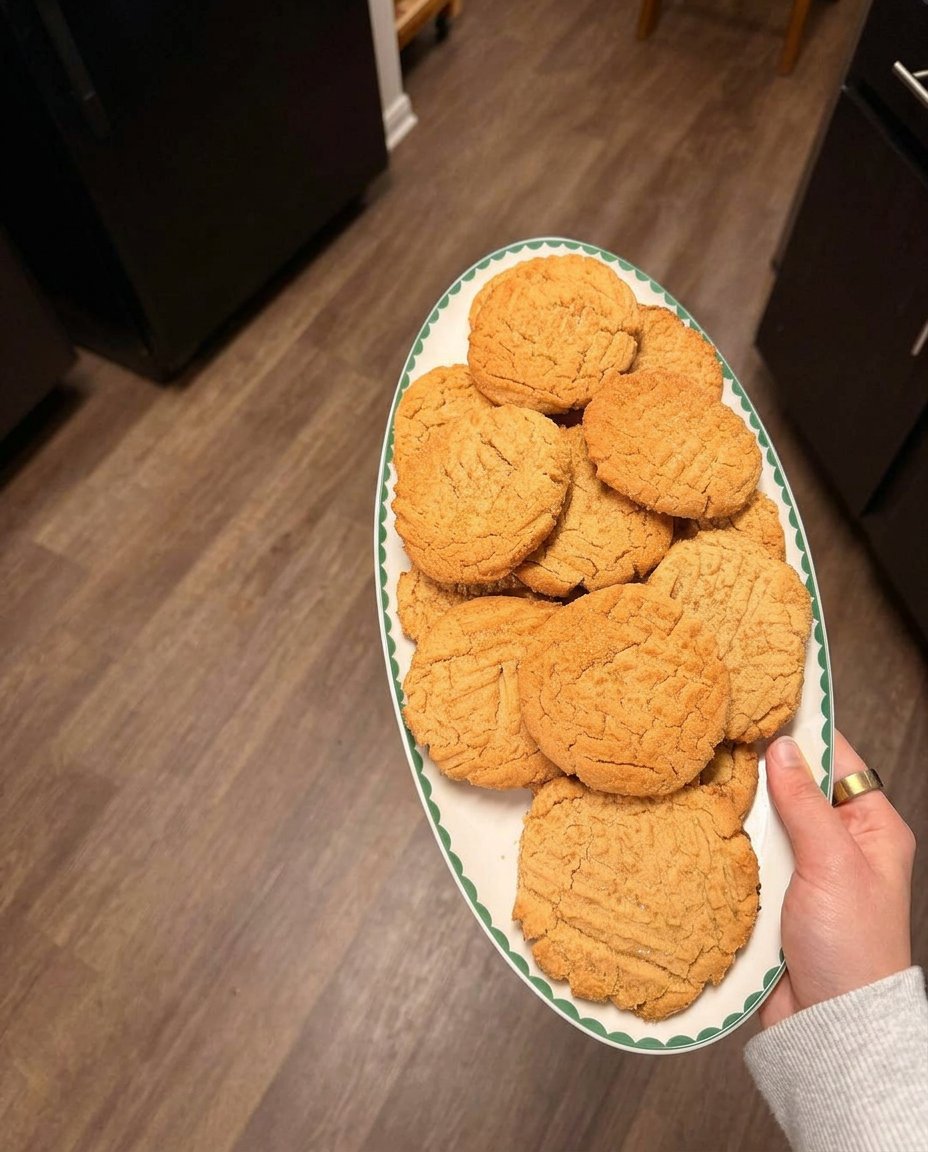 A plate of wholesome peanut butter cookies served with fresh berries