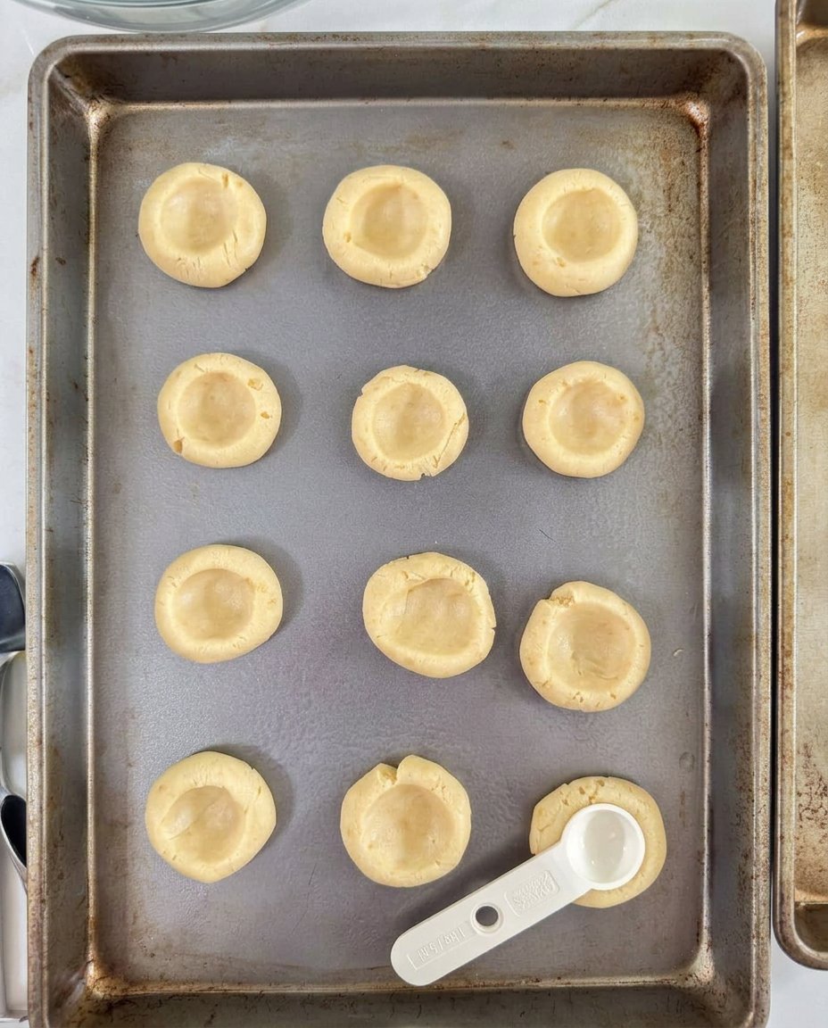 Peach Thumbprint Cookies 13 Hand stuffing chopped peaches into cookie dough indentations